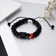 Lion motif and red accent bead — supplier photograph with background lettering removed